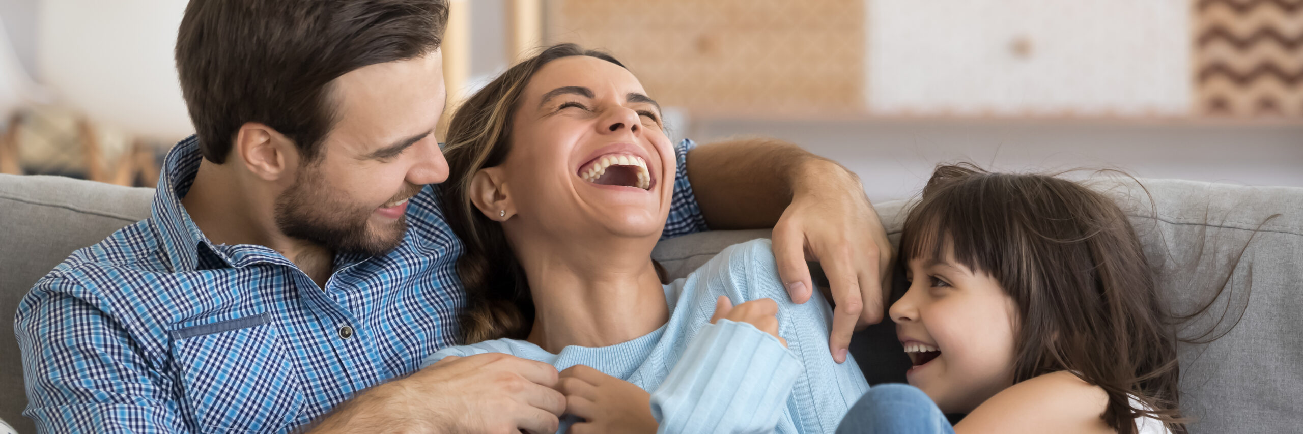 Laughing Husband And Daughter Tickling Mother Family Play Together Having